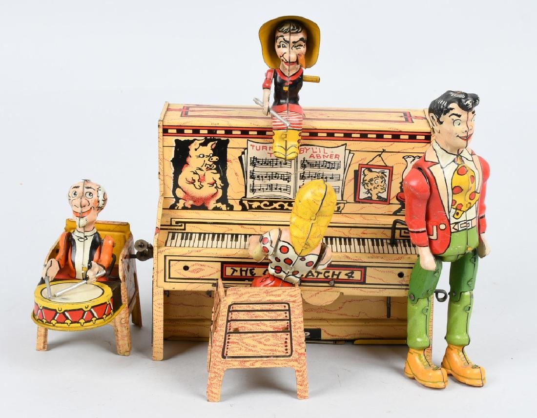 UNIQUE ART Tin Windup LIL ABNER BAND: All original and complete with figures. Grandma is missing 1 arm. Windup works. Very nice colors. 9" Excellent