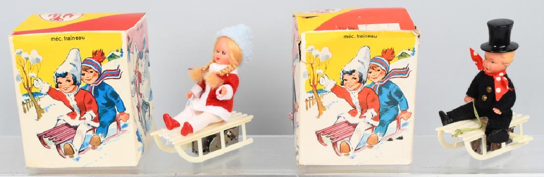 GERMAN WINDUP BOY & GIRL ON SLEDS w/ BOXES (1 of 5)