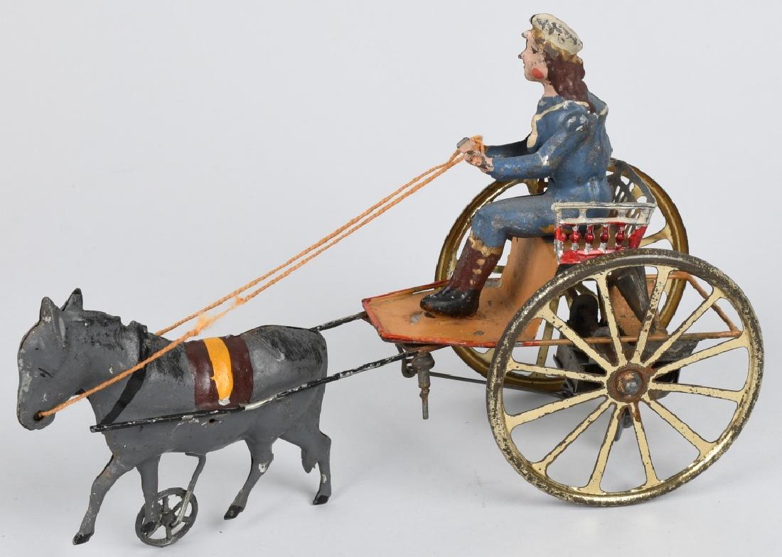 TIN WINDUP MAN IN CARRIAGE PULLED BY HORSE (1 of 7)