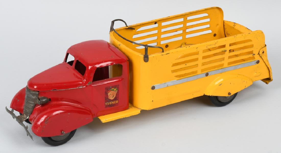 TURNER PRESSED STEEL STAKE BED TRUCK: Nice original truck. Has nice bright paint and clean decals. Hard to find truck. 19" Excellent