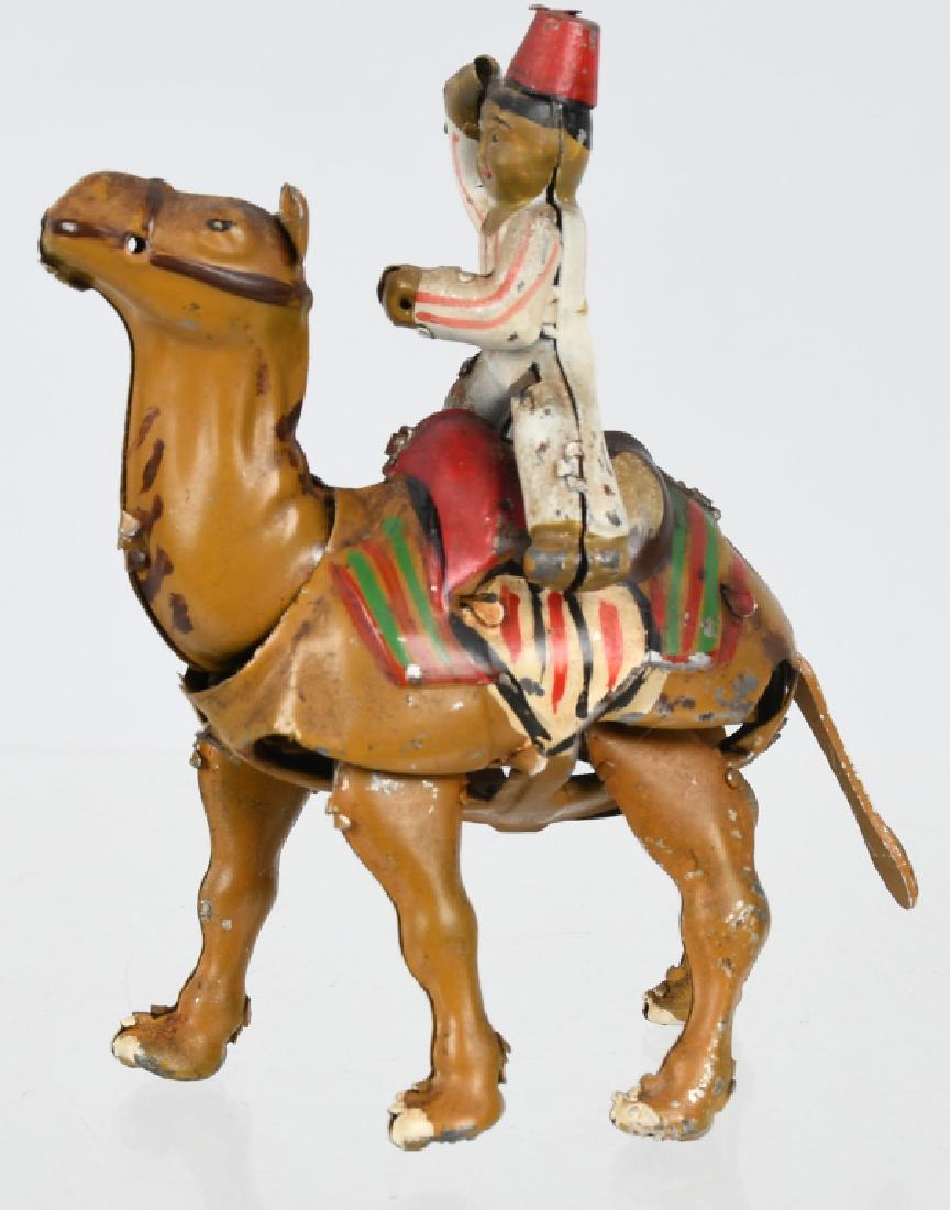 TIN WINDUP CAMEL WITH ARAB RIDER: All original and complete. Works. 4 3/4" Excellent