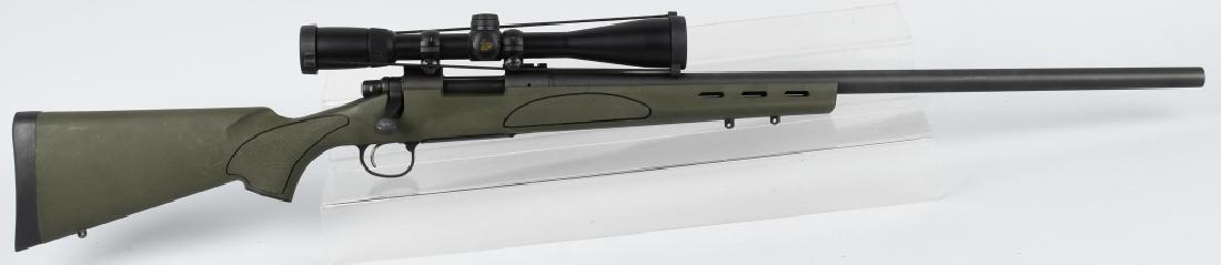 REMINGTON MODEL 700, .223 BOLT ACTION RIFLE: SN G6643222, 26" barrel with excellent bore. Nice gray matte finish, with excellent green polymer stock with sling eyes. Has light rubs on butt stock. Crisp action and includes Nikon Buckmasters scope