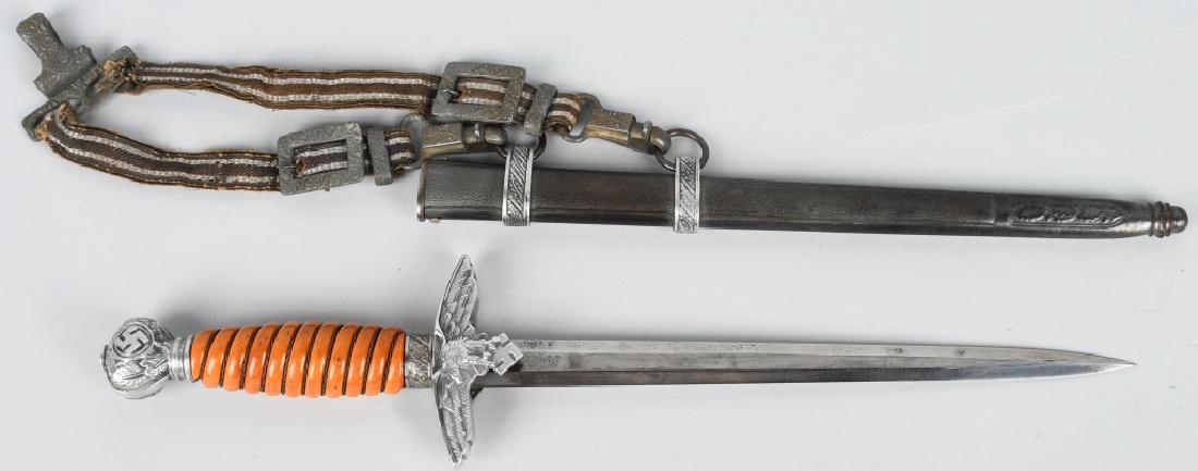 WWII NAZI LUFTWAFFE DRESS DAGGER W/ HANGERS: Nazi German Luftwaffe dress dagger. The blade length is 10" and overall 17". Comes with deluxe pattern hangers. The blade has minor spotting and is maker marked Alcoso. Has orange bakelite handle with