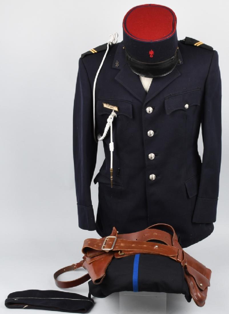 FRENCH MOTORCYCLE POLICE UNIFORM, HATS, HOLSTER: Scarce French Police uniform with Motorcycle badges on the lapels, 2 caps - one sidecap and one Kepi marked "PARIS", both with insignia. Also includes Sam Browne style pistol belt with holster and han