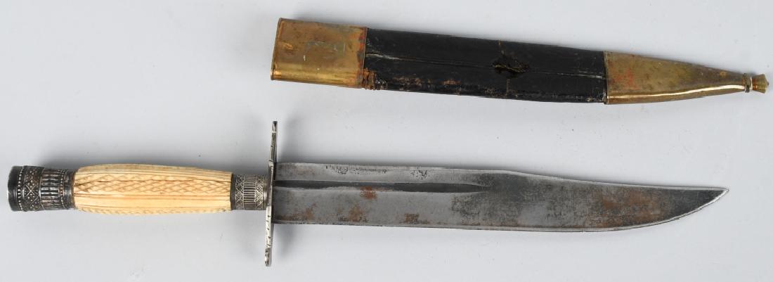 GEORGE WOSTENHOLM IXL 9" BOWIE W/ SCABBARD, CA. 1: 9" Bowie knife with crown pommel and flat crossguard. Approximately 4" groove. Bone handle, checkered and lined. Blade marked "G. WOSTENHOLM & SON WASHINGON WORKS SHEFFIELD" and the trademark I-XL. Co