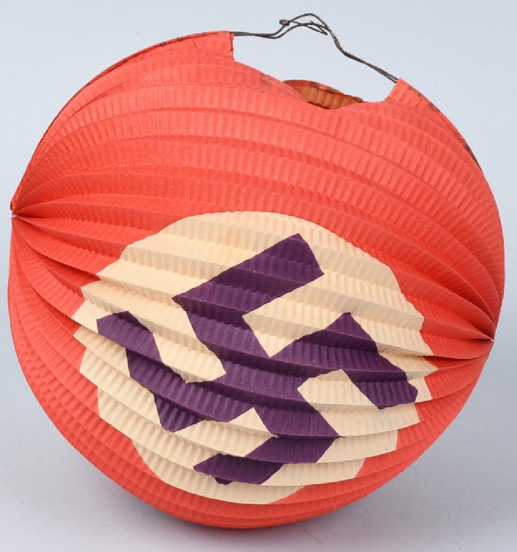 WWII NAZI GERMAN NAZI FLAGS AND LANTERN: Lot of 12 paper Nazi flags measuring 12 X 8 inches and being made of paper and are attached by silken string. Are are in very good condition. Also in the lot is a Chinese style lantern measuring 9 inc