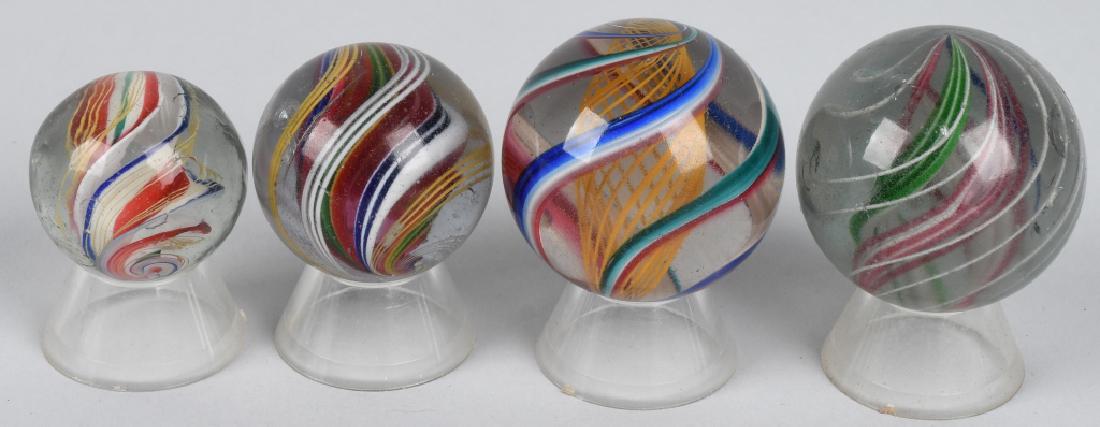 4- LARGE HANDMADE SWIRL MARBLES: Lot of 4 Large Handmade Swirl Marbles. All have been polished. Largest 1 11/32"
