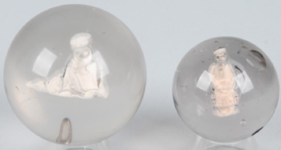 READING CHILD & WOMAN WITH BASKET SULFIDES: RARE Reading Child and Woman with Basket Sulfide Marbles. Both have been polished. Largest 2 1/16"