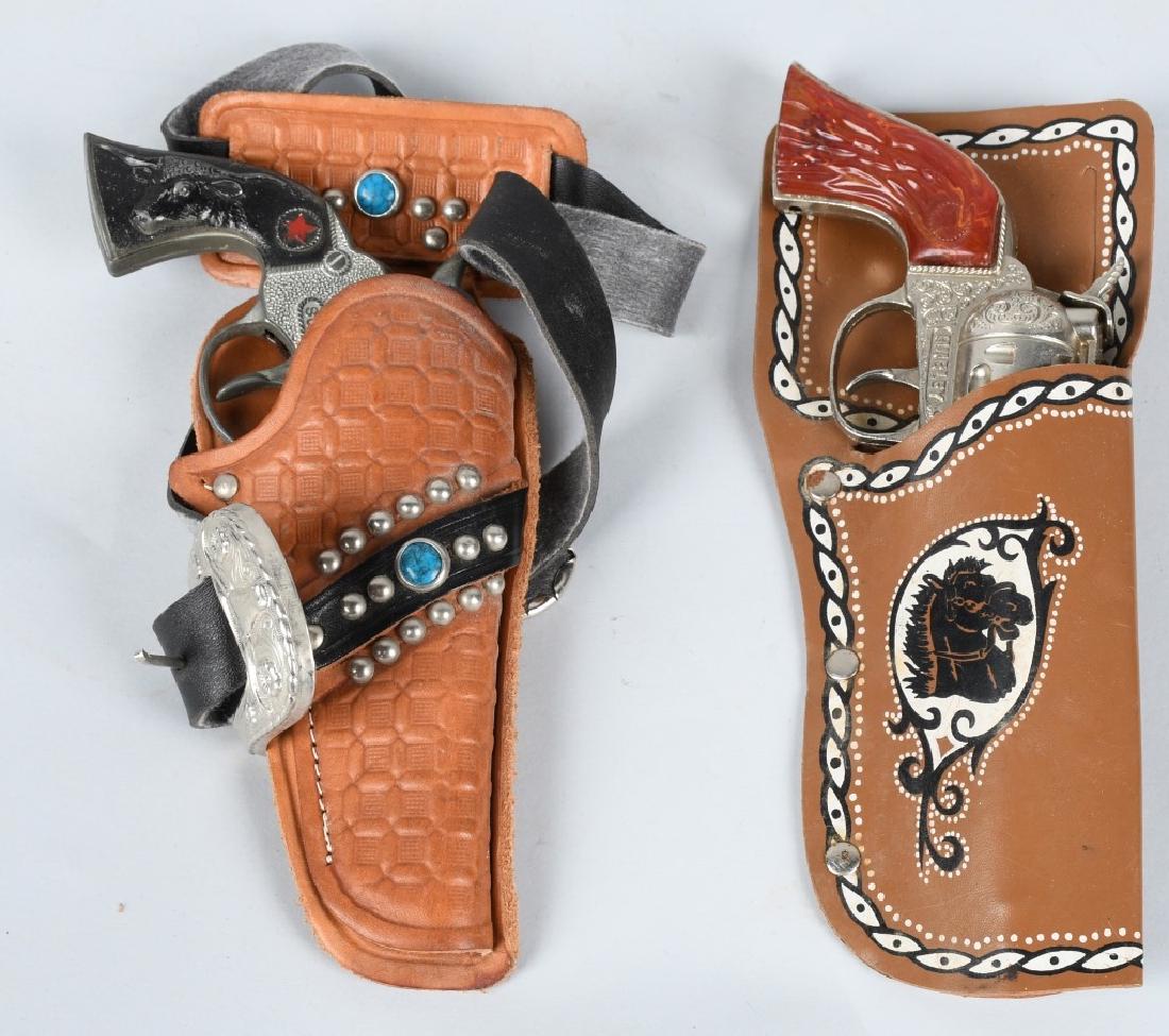 2- CAP GUN & HOLSTER SETS: Include Hubley with Holster and Sure Shot with Holster. Both work. Very Good- Excellent