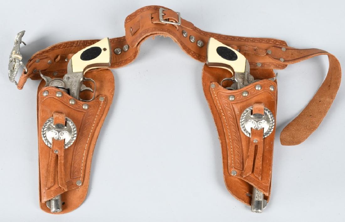MARSHALLCAP GUN SET w/ LEATHER HOLSTER: Pair of Marshall Cap Guns with Leather Holster. Only 1 gun working. Excellent