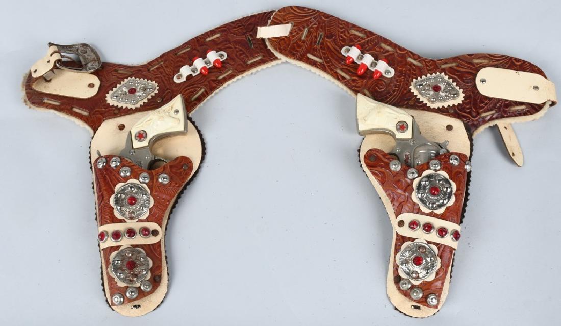 WESTERN CAP GUN SET w/ LEATHER HOLSTER: Pair of Western Cap Guns with Leather Holster. Only 1 gun working. Excellent