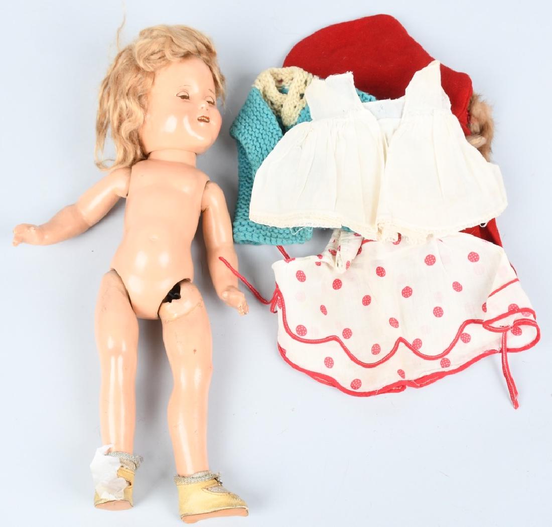 1930'S SHIRLEY TEMPLE COMPOSITION DOLL, IDEAL: Original 1930's Shirley Temple doll measuring 16". has original dress, slip and socks and shoes. Body has light wear and and there is light crazing to face. Strings need tightened. Very Good