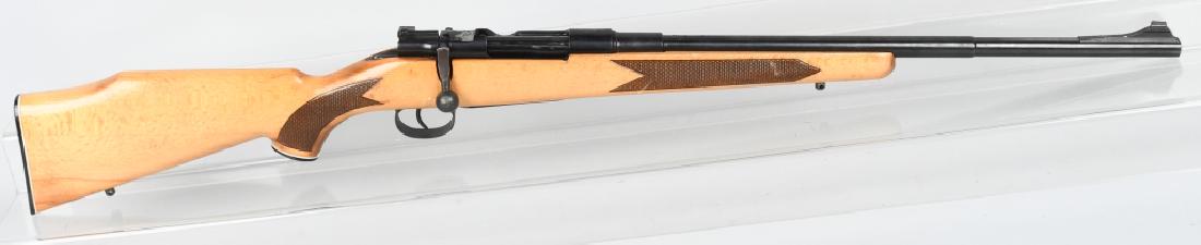 MAUSER BOLT ACTION SPORTER RIFLE 308: SN 40016. 21.25" barrel, bolt action rifle in .308. This rifle is a custom build, with Mauser parts. Has 6 scope-mount holes drilled into the receiver, and blade front sight. Features blonde laminate