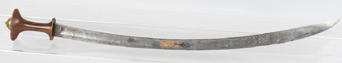 19th CENT. ETHIOPIAN IMPERIAL GUARD SWORD: The sword is 36 1/2" overall with a 31" profusely etched blade. The blade is a British model 1796 type and was made by Henry Wilkinson Pall Mall London, sword maker to H.M. King George V. The grip is 
