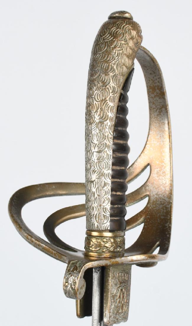 MODEL 1902 MEXICAN CAVALRY OFFICERS SWORD: Sword is 40" overall with a 34" etched blade. One side of blade is etched "Fabrica de Solingen 1902". Spine is marked F. Horster Solingen. Has birds head pommel, and grip is missing twisted wire. Very
