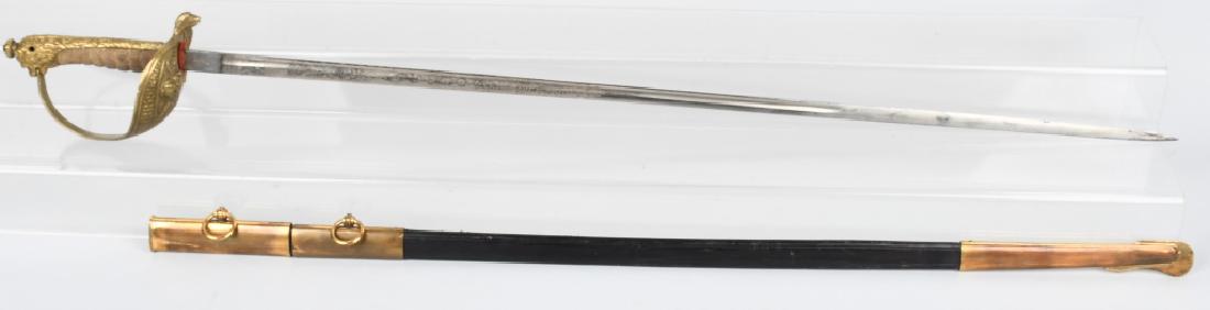 WWII ITALIAN NAVAL OFFICERS DRESS SWORD: Italian Naval Officer's Dress Sword and Scabbard. The solid brass half basket guard has an Italian crown over a fouled anchor and a fold down clip to attach to the scabbard on the back edge. 39" overa