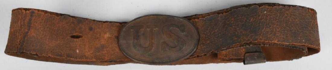 CIVIL WAR MODEL 1839 US BUCKLE and BELT: Untouched all original model 1839 US belt plate with arrow attachment hooks and original leather belt and brass adjuster. Belt measures about 40". A great looking rig with wonderful patina. Very Good