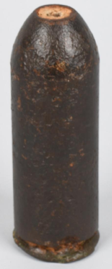 CIVIL WAR PARROTT ARTILLERY SHELL: Original Parrot artillery shell with brass sabot and partial fuse. Has been drilled and rendered inert. Lightly cleaned and coated. Metal shows some ground action About 8 1/2" with a 3" diameter. Very