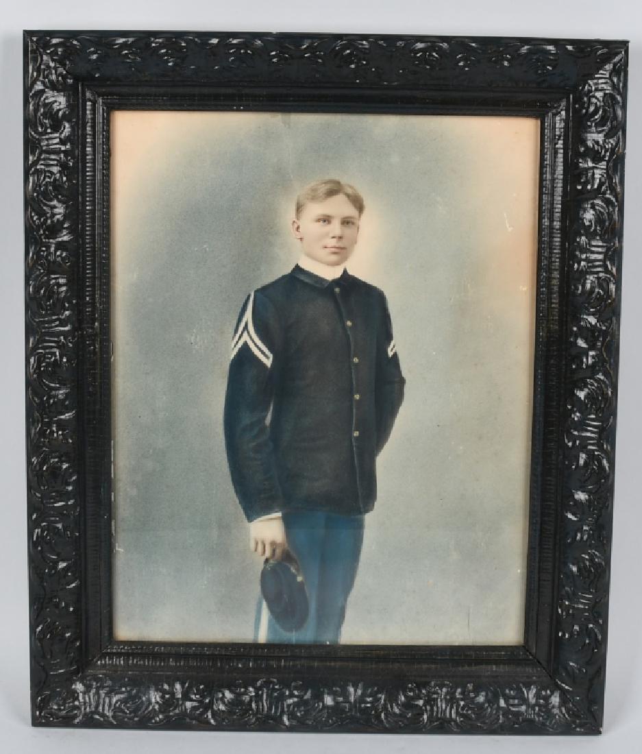 1870s FRAMED PORTRAIT OF INFANTRY NCO: 21.5 x 24.5" Framed, colonized portrait of a soldier wearing a US Army model 1872 sack coat with Corporal stripes and holding a forage cap. Unit insignia is difficult to make out, but he is a post-Civ