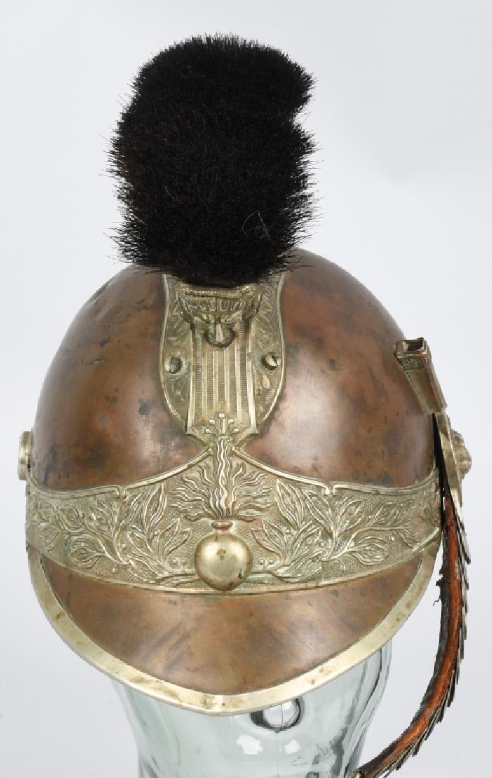 FRENCH CUIRASSIER OFFICER'S HELMET 19th C.: French Cuirassier officer's helmet with brass edging, fittings, and a crest with repoussa decoration, the head of Medusa at the front, above a crest with a grenade. The front peak and the back is a sh