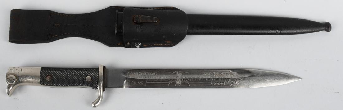 WWII NAZI GERMAN SINGLE ENGRAVED BAYONET W/ FROG: Roughly, 20cm long, nickel/silver plated, drop forged, steel construction blade with deep fullers to each side and a top edge to the forward tip. The blade is in overall good condition with light scab