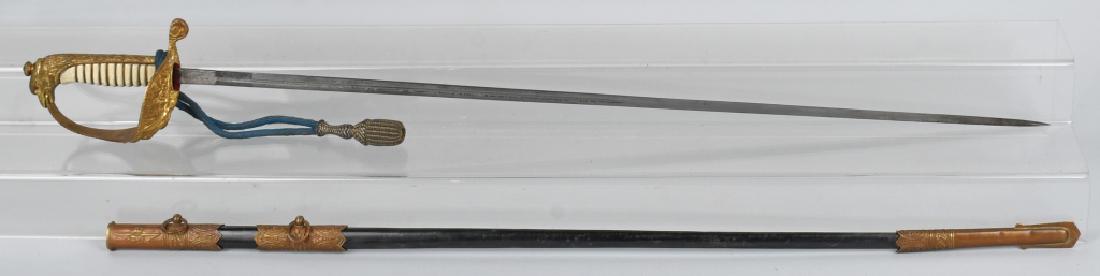 WWII ITALIAN AIR FORCE OFFICER SWORD WITH KNOT: WWII Italian officer's dress sword by E&F Horster of Solingen with eagle head pommel and feathered wing guard design. Double etched blade. White grips show minor wear. Scabbard present and also in ver