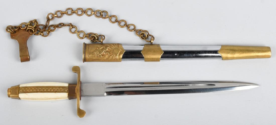 BULGARIAN ARMY OFFICERS CHAINED DAGGER: Bulgarian Officer's chained dagger. White squared Bakelite type grip with a vertical designed gilt brass center strip. Brass "S" shaped cross guard. 9 1/8" double edged clean blade with a center fulle