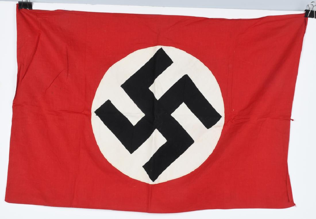 WWII NAZI GERMAN NSDAP SMALL PARTY FLAG: A multi-piece cotton construction banner approximately 19 X 28 inches. To both its red fields are sewn a white disks, with a multi piece mobile swastikas in black. Some expected age and use. Excellent
