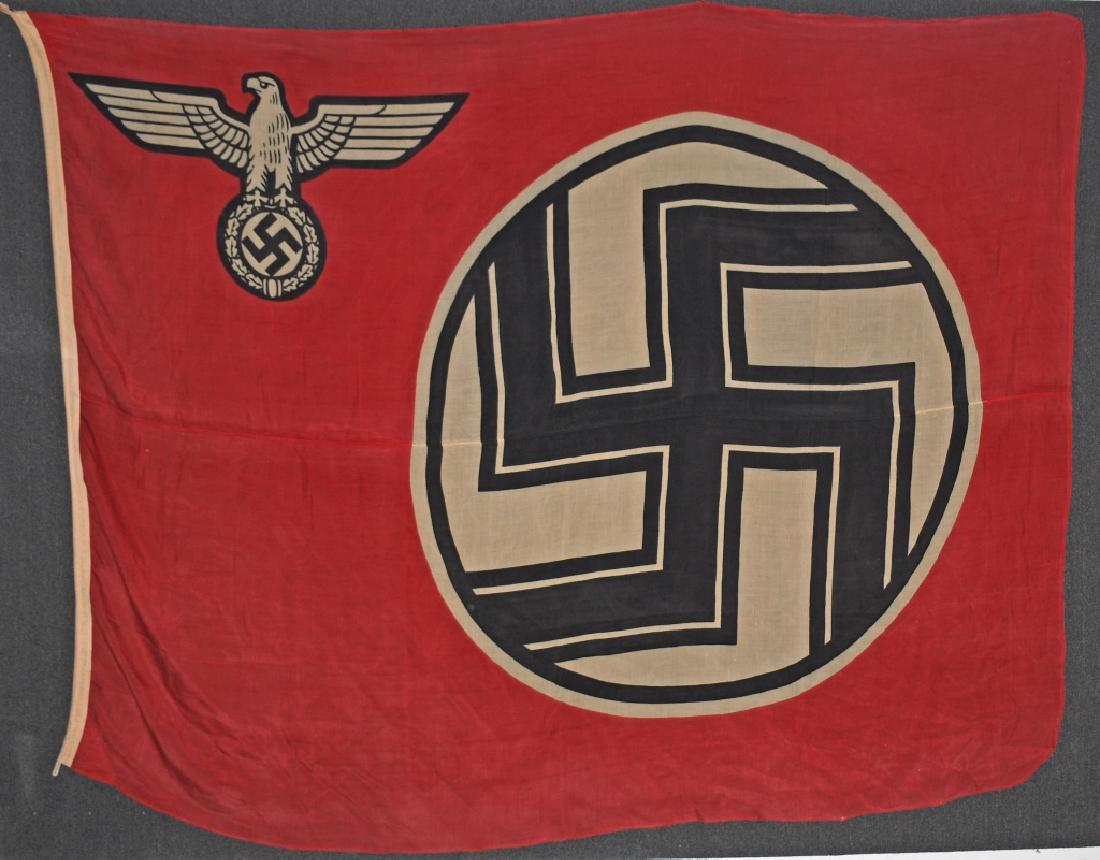 WWII NAZI GERMAN STATE SERVICE FLAG: A 1935 pattern, double sided, printed, cotton/linen construction flag. The flag features a red base field white with a white, central, circular field with a black and white bordered, black static swas