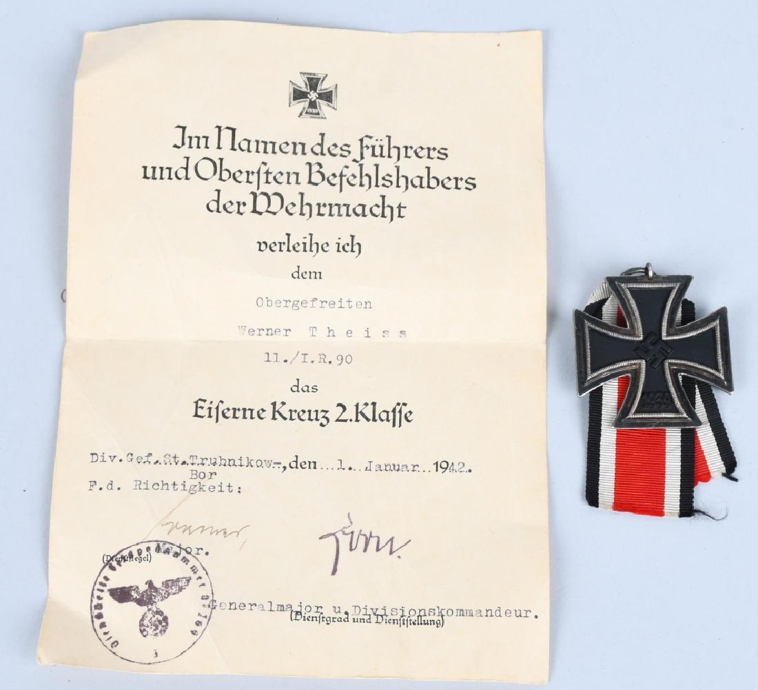 WWII NAZI GERMAN IRON 2ND CROSS MKD WITH DOCUMENT: WWII Nazi German EKI or Iron Cross 2nd class with a ring marking of 24 indicating the maker Arbeitsgemeinschaft der Hanauer Plakettenhersteller, Hanau am Main. The document is named to Obergefreiten W