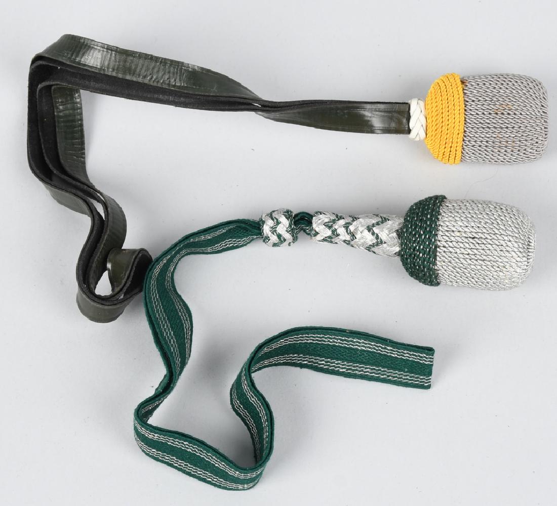 WWII NAZI GERMAN NCO SWORD / BAYONET KNOT LOT OF2: Lot of two Army NCO's Troddels, the first has green textured strapping with stitched aluminum lines. The slide and stem have the standard "V" weave accent with green. The cap is a speckled example in 
