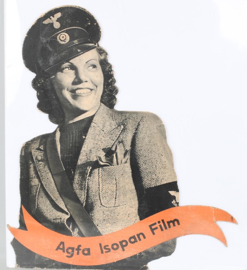 WWI NAZI GERMAN AGFA FILM LARGE ADVERTISEMENT: Large WWII Nazi German heavy card stock advertisement for Agfa Isopan film. Measuring 23 X 26 inches, this advertisement depicts a female Deutsche Reichspost worker wearing her visor vat and armband w