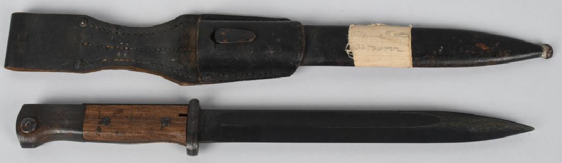 WWII NAZI GERMAN K 98 BAYONET clc 44 CODE: German bayonet with scabbard and leather frog. Good finish, great handle, scabbard has some wear. Marked G1414 near ricasso, and "clc 44" code, Waffenamt on pommel, **122* on scabbard. Excellent.