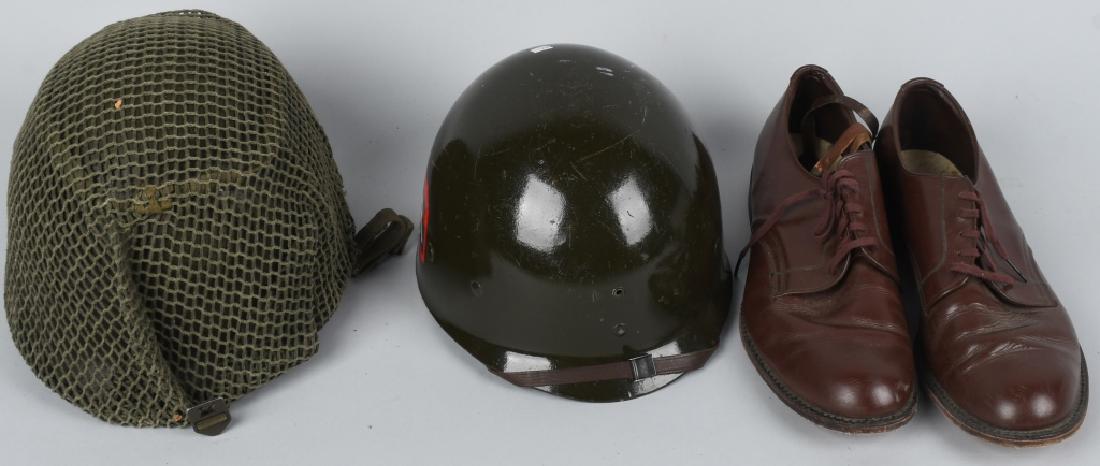 WWII US FIXED BALE HELMET LINER AND SVC SHOES: World War II lot includes fixed bale M1 "Steel Pot" helmet with sewn-chinstraps. This looks like a Korean War era rework with OD green chinstraps, OD green "shrimp net" camouflage, and includes a Mica