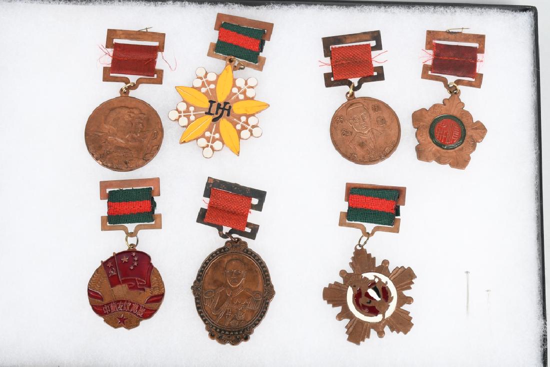 LOT OF 7 MAO ERA CHINESE COMMUNIST MEDALS: 7 Medals dating from the Mao era, communist party medals and military medals. Excellent