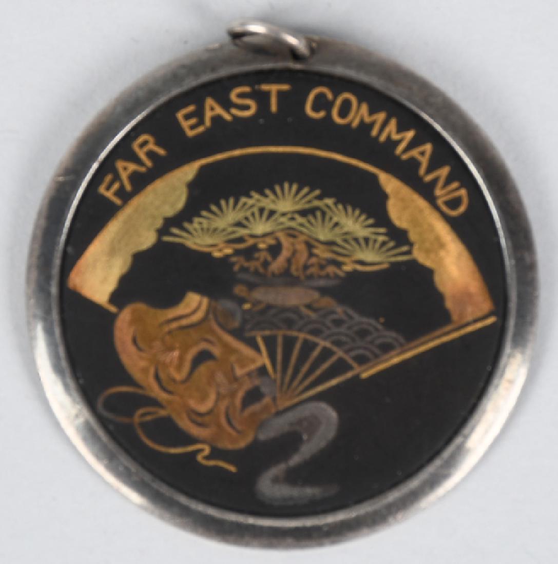 MEDAL ENGRAVED TO USO PERFORMER JOHNNY JONES: Small medal with "FAR EAST COMMAND" on the front, inscribed on the back, "TO Johnny Jones In appreciation for entertaining armed forces personnel July, 1957." Little Johnny Jones served in the US Navy