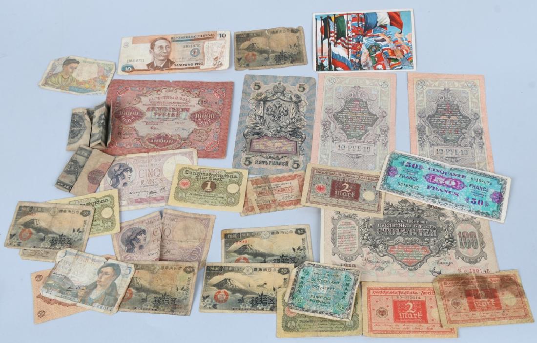 INTERNATIONAL PAPER NOTE CURRENCY COLLECTION: Includes Tsarist / Imperial Russian notes, dated 1909, 1910; Bolshevik era notes with international versions of the slogan, "WORKERS OF THE WORLD, UNITE!"; WWII French and German notes, WWII Japanese 