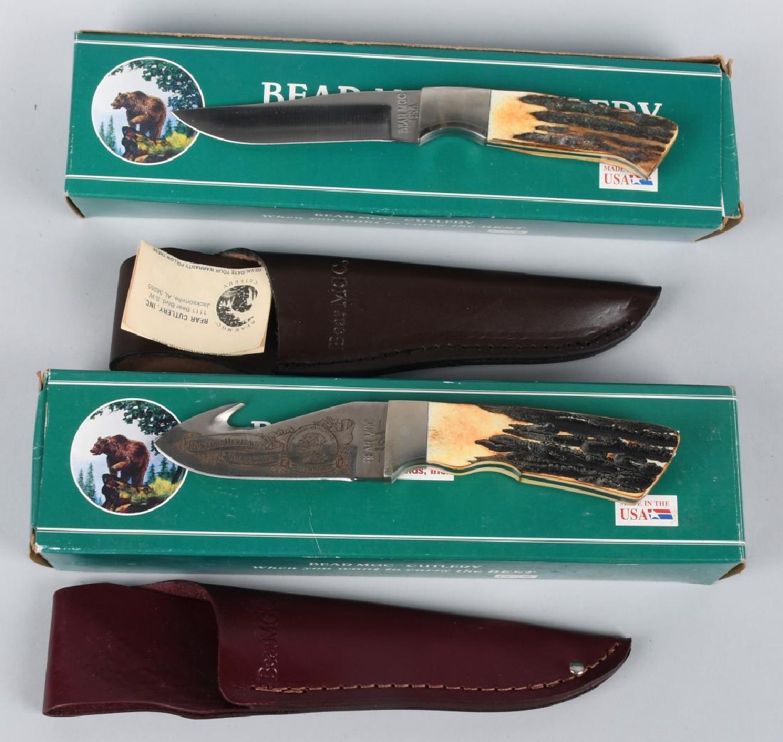 TWO BOXED BEAR MGC CUTLERY FIXED BLADE KNIVES: New in the box; pair of Bear MGC Cutler collectible knives, both with stag handles. 8" overall; 3.75" blade "Guthook" etched on the blade with the logo of the North American Hunting Club, and "Hunting