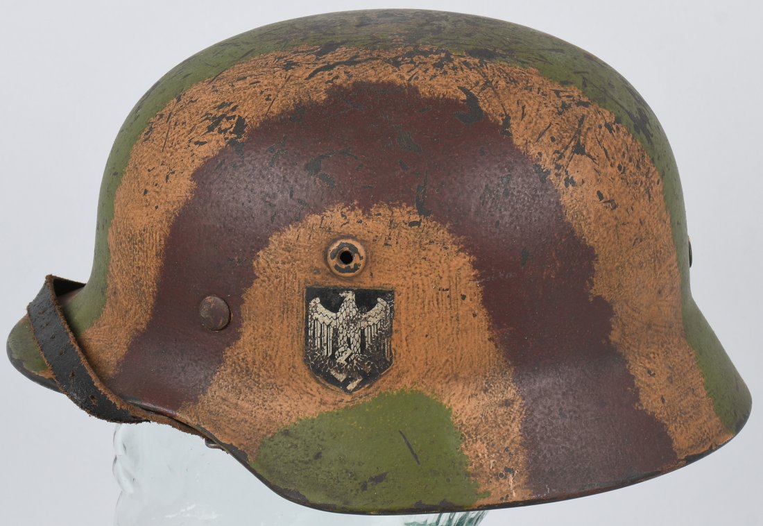 WWII GERMAN M40 Q66 SD HEER NORMANDY CAMO HELMET: This helmet appears to be somewhat of a hybrid as the decal is metallic and of the correct design i.e. a bigfoot Quist eagle with the flattened head and extra large talons however the camo paint is a 