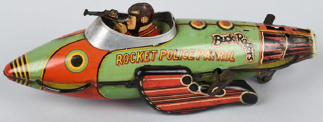 MARX Tin Windup BUCK ROGERS POLICE PATROL: All original and working. Missing tail fin. Has wear. 12" Very Good