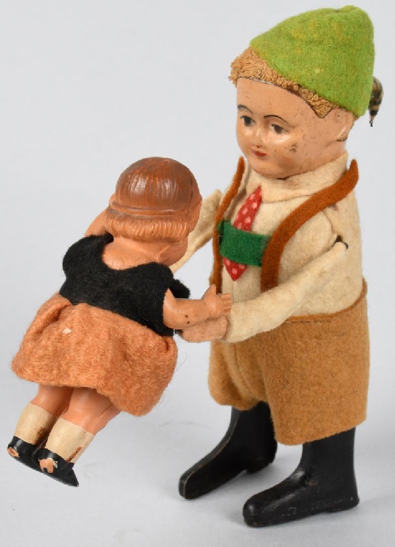 SCHUCO WINDUP GERMAN BOY WITH BABY: All original and complete. Works. 5" Excellent