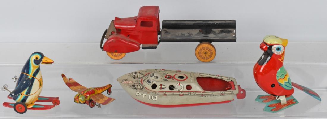 VINTAGE TIN TOY LOT JAPAN WYANDOTTE and MORE: Lot incldues incomplete 1930's Wyandotte Circus truck, a TN Japan friction penguin, a red China windup bird, a Japn friction Dragion Fly, and a 91/2" Marx PT10 boat. Condition varies, Overall Very Goo
