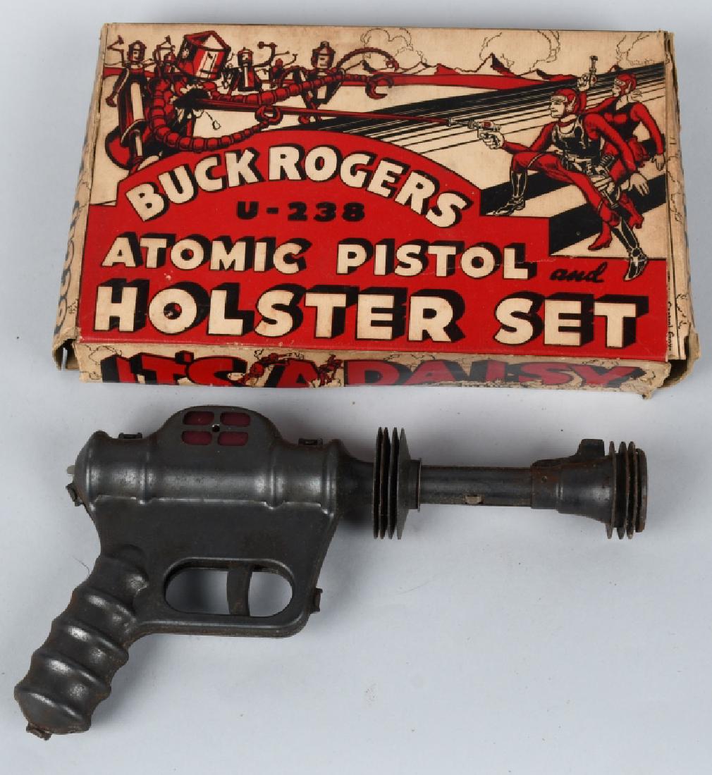 DAISY BUCK ROGERS ATOMIC PISTOL w/ BOX: All original and works. Has light surface rust. With scarce pistol and holster set box. Very Good