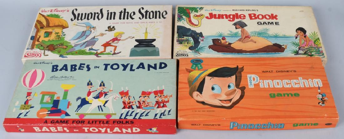 4- VINTAGE WALT DISNEY BOARD GAMES: Includes Sword in The Stone, Pinocchio, Jungle Book, and Babes In Toyland. All look mostly complete with colorful boxes. Largest 17" Excellent