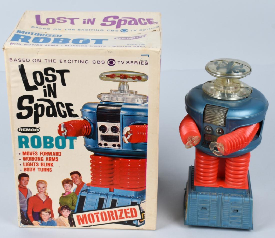 REMCO LOST IN SPACE ROBOT w/ BOX: All original with no breaks. Missing battery bar. Lights up when tested. With very nice box. 14" Excellent