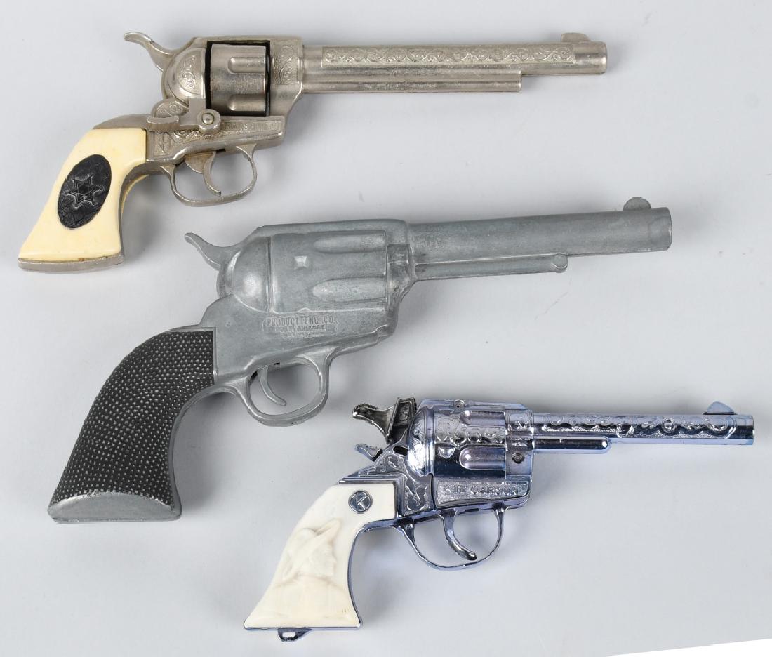 3 VINTAGE CAP GUNS KIT CARSON and MORE: Lot includes Kit Carson cap pistol that appears unfired, a Marshall cap pistol and a .45 Smoker cap pistol. Worked when tested. Very Good-Excellent