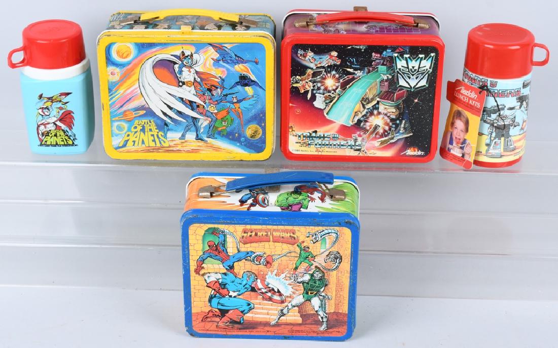3 VINTAGE LUNCH BOXES TRANSFORMERS and MORE: Lot includes 1986 Transformers lunch box with thermos and hang tag, 1984 Secret Wars without thermos, and 1979 Battle of the Planets with thermos. Condition varies. Good-Very Good