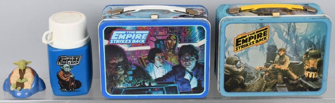 2 1980 STAR WARS EMPIRE STRIKES BACK LUNCH BOXES: Lot includes 2 different Star Wars lunch boxes. One has the original thermos. Includes a Yoda figurine. Very Good-Excellent