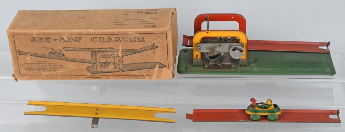 TIN WINDUP SEE-SAW COASTER TOY w/ BOX: All original and complete. Windup works. Comes in unusual mailer style box. 12" Excellent