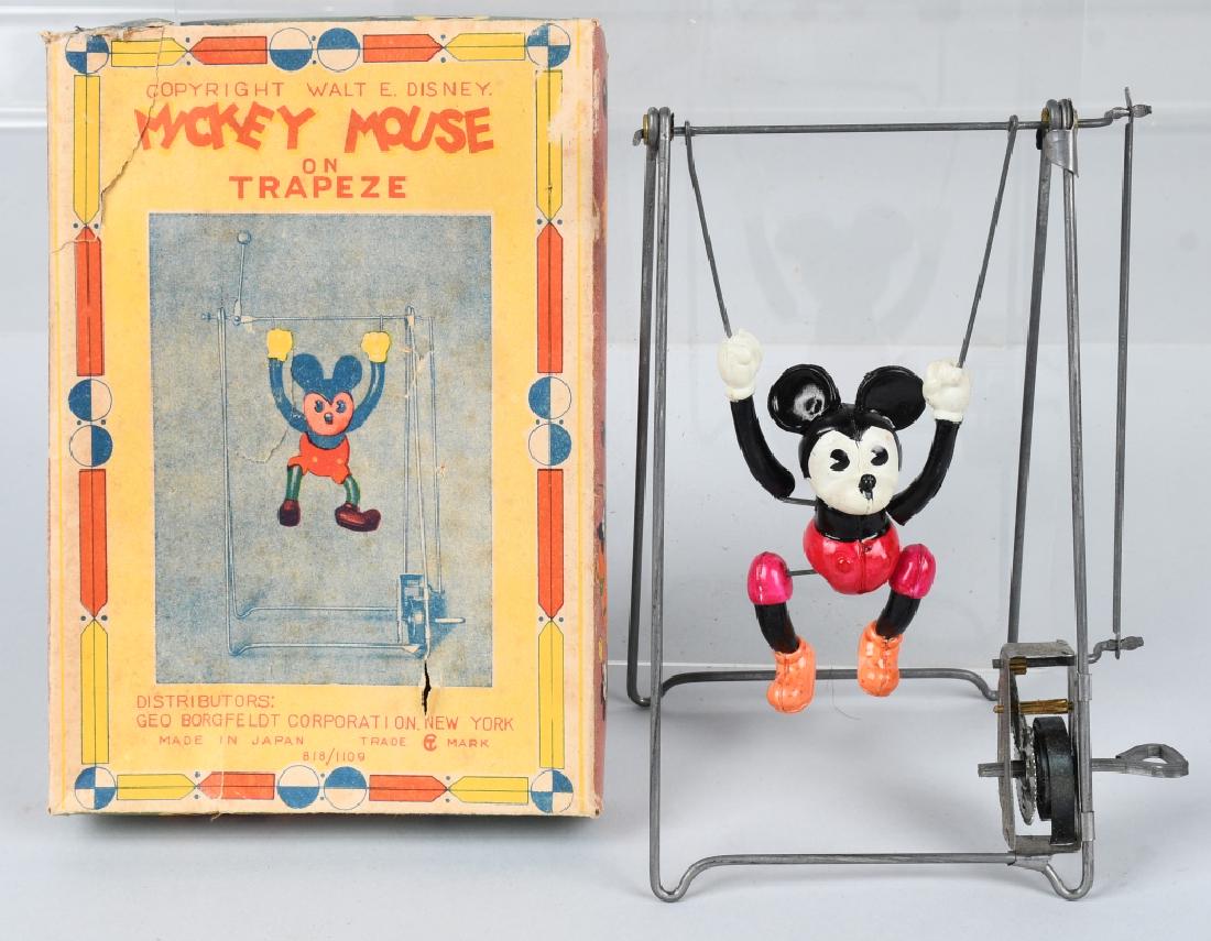 JAPAN Celluloid Windup MICKEY MOUSE TRAPEZE w/ BOX: Mickey Mouse on Trapeze. Very unusual version with smaller celluloid Mickey Mouse figure and more colorful box art. Figure is all original and in great condition. Very nice colors. Windup works. Comes